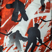 Hockey-themed fabric with black silhouettes of hockey players on a red and white background